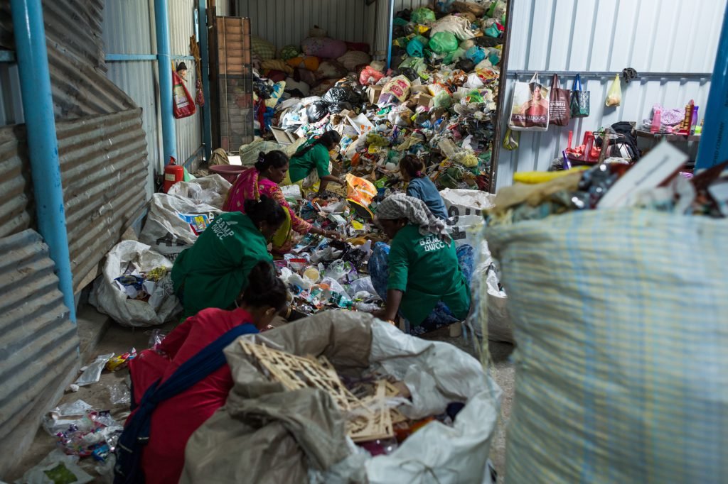 Workers sorting plastic waste